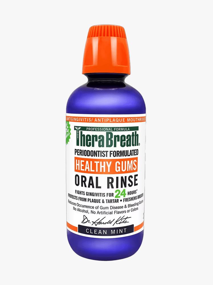 Therabreath Healthy Gums Oral Rinse in blue branded bottle component with orange cap on a light gray background