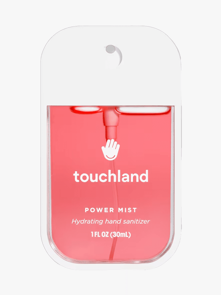 Touchland Hand Sanitizer in clear branded spray component with white accents on a light gray background